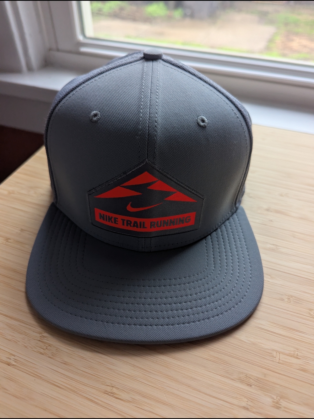 Nike Gray Snapback Hat with Orange Trail Logo